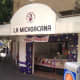 La Michoacana (&quot;the woman from Michoacan&quot;), a popular ice cream shop chain in Mexico. The sign says they also sell elote (corn on the cob) and esquites (corn kernels with mayonnaise, chile and epazote).