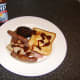 HP Sauce is an optional addition to the leg of pork mixed grill