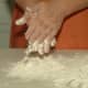 Coat your clean hands in flour before kneading the wet dough so it won't stick.