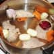 Bringing stock ingredients to a simmer.