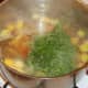 Thigh meat and parsley are added to soup to heat through