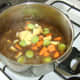 The vegetables are added to the reduced stock and venison