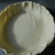 Place the ready made pie crust in a pie pan.