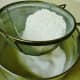 Sifting the dry ingredients into a separate bowl