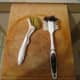 These are soft scrubbing brushes used to clean the pans after use with the help of hot water. No soap is required!