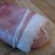 Chicken breast piece, wrapped in cured ham.