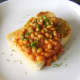 Baked beans with garlic served on a thick slice of toasted farmhouse bread and garnished with chopped chives.