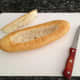 1. Flip the sub over so that the ends point upward, and then carve out the middle to make a boat.