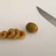 3. Slice 3-4 rings of green olives.