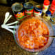 Mix together refried beans, tomatoes, tomato sauce, chicken, and spices in bowl.