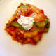 A serving of chicken fajita casserole with sour cream.