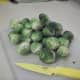 Cut the stems off of the raw brussel sprouts. It's okay if the outer layers fall off.  If using frozen brussel sprouts, this step is not necessary because stems are already cut off.