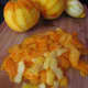 Oranges (and one lemon) are peeled, and the peel is ready for cutting into slivers.