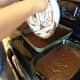 Pour the cake mix into the pans.