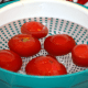 Drop the blanched tomatoes in ice-water.