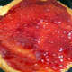 Cover one layer of the cake with raspberry jam.