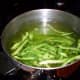 First, boil green peppers for three minutes.