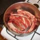 Beef and bones are added first to stock pot