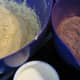 Add the flour/cocoa mixture and sour cream to the creamed butter/sugar/eggs, in three alternating lots.