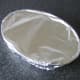 Foil covers the casserole for baking