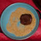 Roll one side of the ball in the raw sugar.