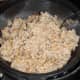 The cooked oatmeal draining and cooling. I place the hot oatmeal into a metal colander and let it sit for about 30 minutes. All the excess liquid will drain out. Fluff it with a fork.