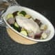 Remove stuffed chicken breast and vegetables from oven