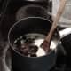 Add chocolate to melted butter in saucepan.