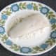 Pollack is patted in seasoned flour on its skin side