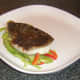 Pollack fillet is laid on bell pepper bed