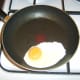 Egg is fried in a separate pan