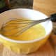 Whisk eggs with milk in a separate bowl.