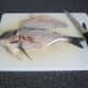 First fillet is removed from the sea bream