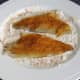 Skin sides or sea bream fillets are patted in seasoned flour