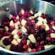 The cranberry-apple mixture is beginning to boil.
