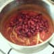 Red kidney beans are added to pot