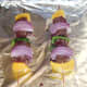 Kangaroo skewers are grilled on foil covered tray