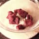 Kangaroo meat is tossed in seasoned flour
