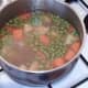 Kangaroo stew is given final simmer to defrost and heat the peas