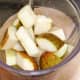 Apples, pear, white wine and lime juice ready for blending
