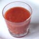 Vodka and tomato puree combination is poured in to serving glass
