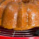 Glaze the hot cake by brushing on or spooning the hot glaze over every inch of the cake.