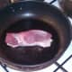 Duck breast skin is seared in dry pan