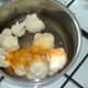 Cauliflower is seasoned with turmeric and salt