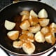 Potatoes and onion are seasoned with curry powder