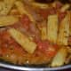 Cook the baby corn in the tomatoes and onions.