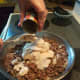 Step 5: Add cream of mushroom soup. Mix well. Cook for a few minutes to warm the soup.