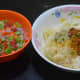 The ingredients for making the batter and the chopped vegetables in separate bowls.