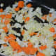Step 3: Sauté chopped carrot and cabbage in butter.