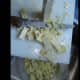 Using sharp knife, slice the kernels off the cob